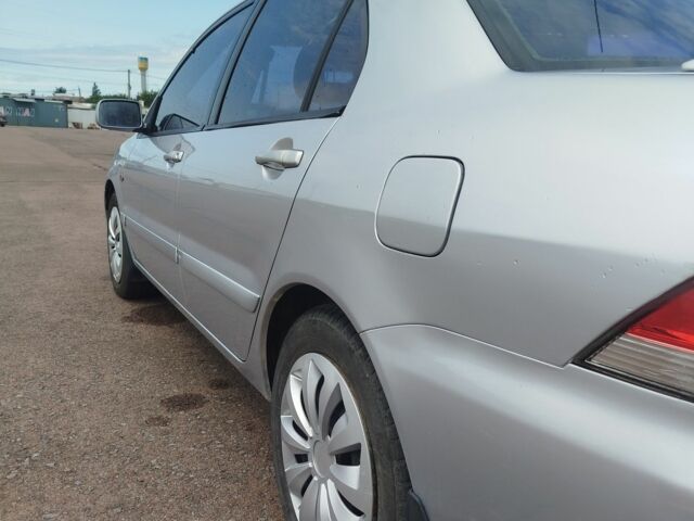 Серый Мицубиси Лансер, объемом двигателя 1.6 л и пробегом 250 тыс. км за 3600 $, фото 17 на Automoto.ua