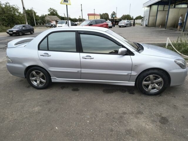 Серый Мицубиси Лансер, объемом двигателя 2 л и пробегом 212 тыс. км за 4300 $, фото 3 на Automoto.ua