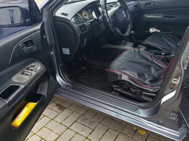 Серый Мицубиси Лансер, объемом двигателя 1.6 л и пробегом 100 тыс. км за 3500 $, фото 6 на Automoto.ua