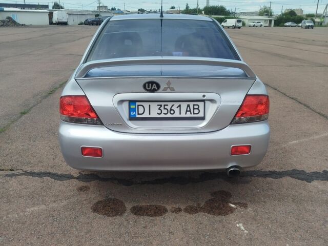 Серый Мицубиси Лансер, объемом двигателя 1.6 л и пробегом 250 тыс. км за 3600 $, фото 6 на Automoto.ua