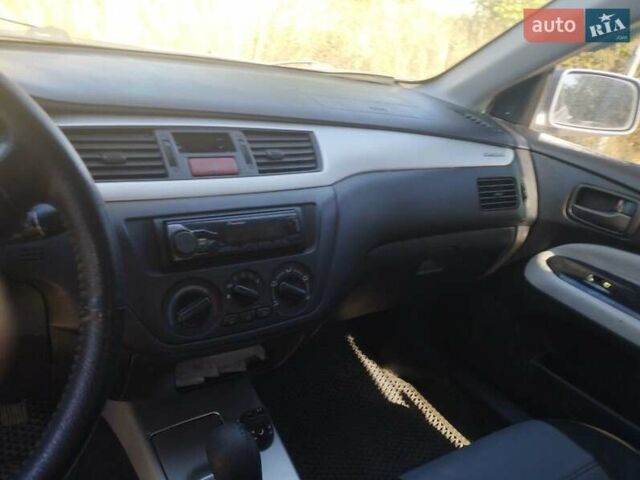 Сірий Міцубісі Lancer, об'ємом двигуна 1.6 л та пробігом 244 тис. км за 3300 $, фото 9 на Automoto.ua
