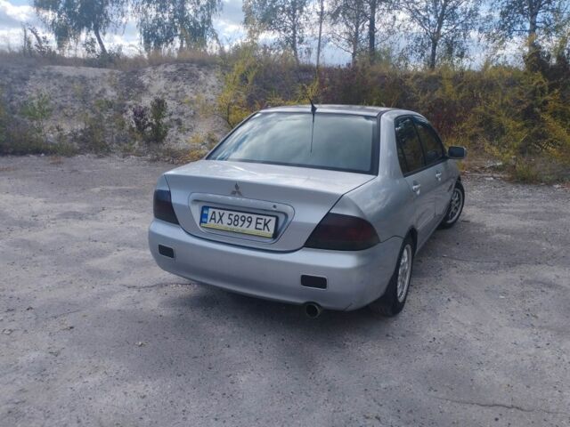 Сірий Міцубісі Lancer, об'ємом двигуна 1.6 л та пробігом 244 тис. км за 3300 $, фото 4 на Automoto.ua