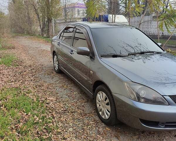 Сірий Міцубісі Lancer, об'ємом двигуна 1.6 л та пробігом 400 тис. км за 5000 $, фото 1 на Automoto.ua