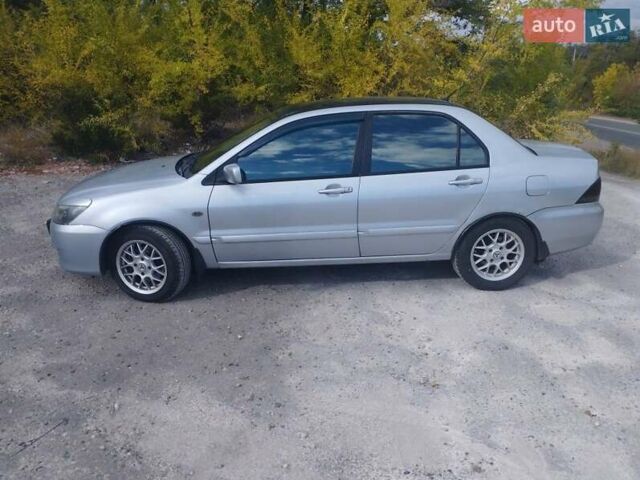 Сірий Міцубісі Lancer, об'ємом двигуна 1.6 л та пробігом 244 тис. км за 3300 $, фото 5 на Automoto.ua