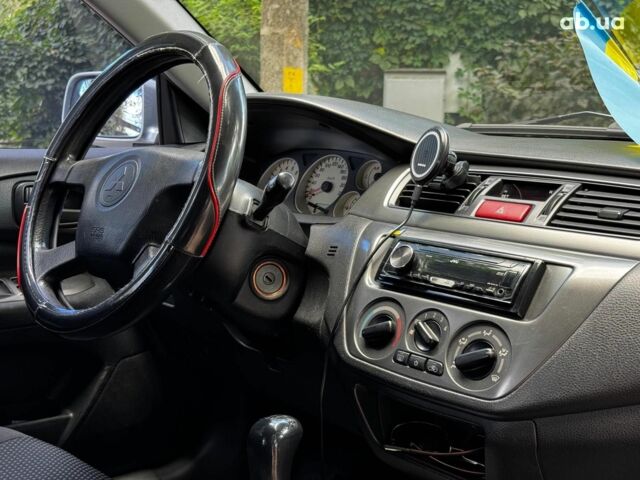 Мицубиси Лансер 2005 в Киеве на Automoto.ua Серый Мицубиси Лансер, объемом двигателя 1.6 л и пробегом 196 тыс. км за 4490 $, фото 26 на Automoto.ua