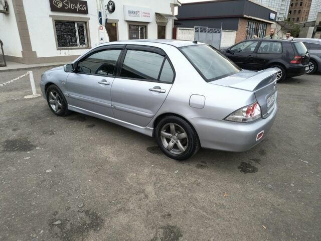 Серый Мицубиси Лансер, объемом двигателя 2 л и пробегом 212 тыс. км за 4300 $, фото 6 на Automoto.ua