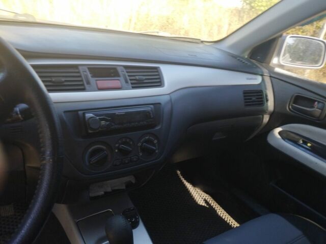 Сірий Міцубісі Lancer, об'ємом двигуна 1.6 л та пробігом 244 тис. км за 3300 $, фото 10 на Automoto.ua