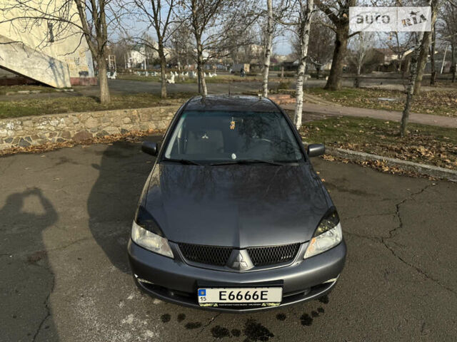 Сірий Міцубісі Lancer, об'ємом двигуна 1.58 л та пробігом 338 тис. км за 4700 $, фото 1 на Automoto.ua