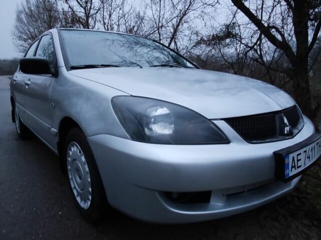 Серый Мицубиси Лансер, объемом двигателя 1.6 л и пробегом 235 тыс. км за 2850 $, фото 19 на Automoto.ua