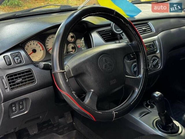 Серый Мицубиси Лансер, объемом двигателя 1.6 л и пробегом 196 тыс. км за 4490 $, фото 13 на Automoto.ua