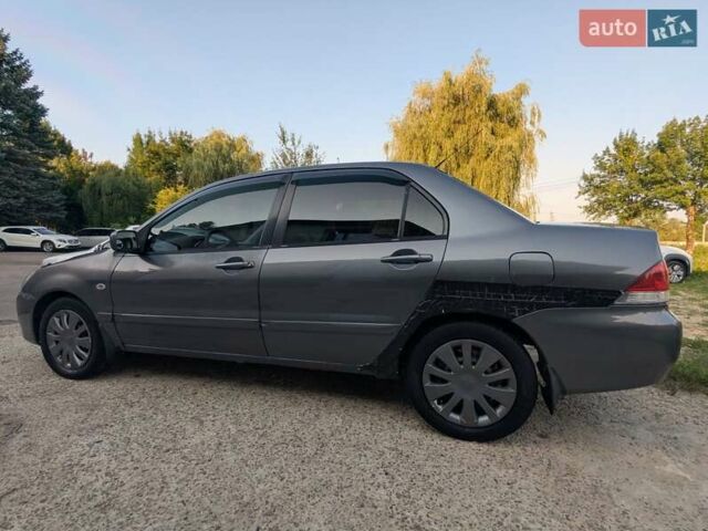 Сірий Міцубісі Lancer, об'ємом двигуна 1.58 л та пробігом 384 тис. км за 2500 $, фото 5 на Automoto.ua