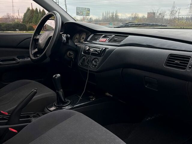 Сірий Міцубісі Lancer, об'ємом двигуна 1.6 л та пробігом 236 тис. км за 3800 $, фото 10 на Automoto.ua