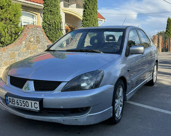 Сірий Міцубісі Lancer, об'ємом двигуна 2 л та пробігом 346 тис. км за 3200 $, фото 19 на Automoto.ua