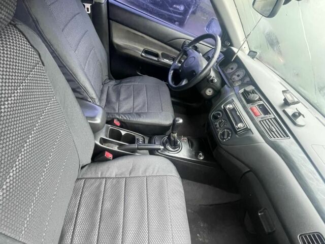 Серый Мицубиси Лансер, объемом двигателя 1.6 л и пробегом 200 тыс. км за 3906 $, фото 6 на Automoto.ua