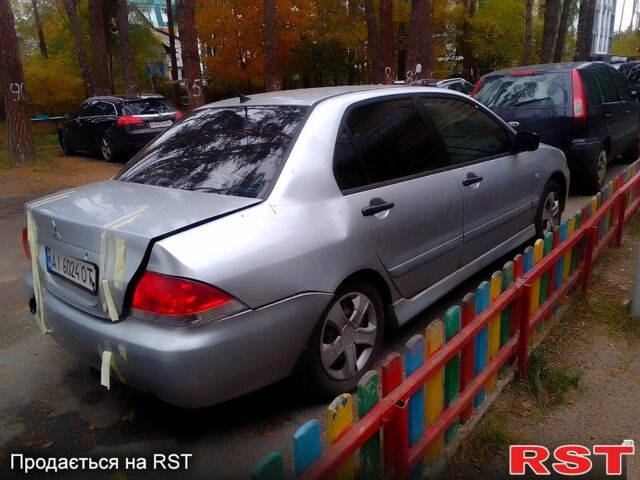 Сірий Міцубісі Lancer, об'ємом двигуна 1.6 л та пробігом 360 тис. км за 1999 $, фото 1 на Automoto.ua