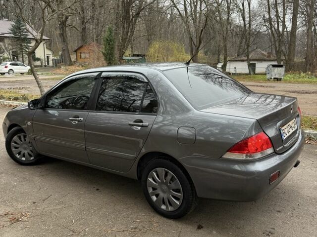Сірий Міцубісі Lancer, об'ємом двигуна 1.6 л та пробігом 230 тис. км за 2799 $, фото 12 на Automoto.ua