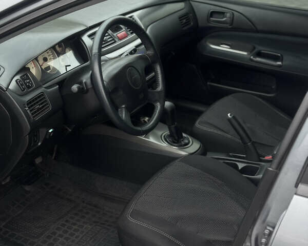 Серый Мицубиси Лансер, объемом двигателя 1.58 л и пробегом 237 тыс. км за 2999 $, фото 8 на Automoto.ua