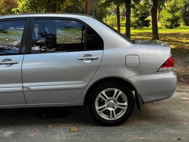 Серый Мицубиси Лансер, объемом двигателя 1.6 л и пробегом 196 тыс. км за 4390 $, фото 9 на Automoto.ua