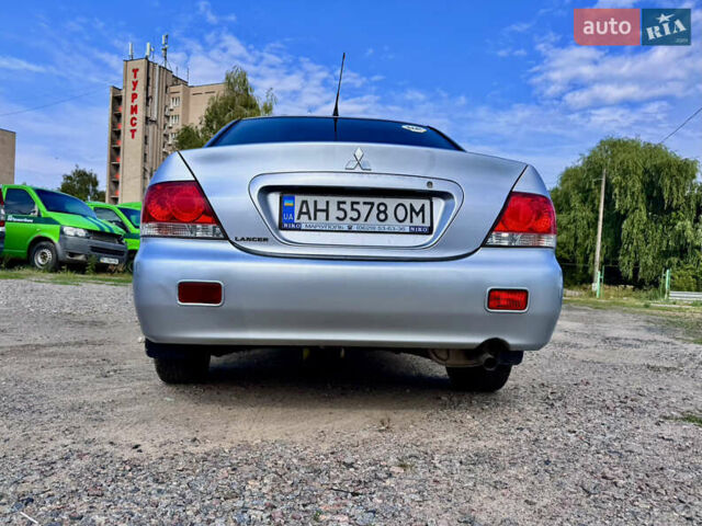 Сірий Міцубісі Lancer, об'ємом двигуна 1.58 л та пробігом 292 тис. км за 5000 $, фото 9 на Automoto.ua