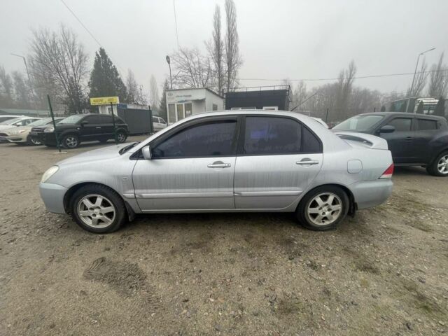 Серый Мицубиси Лансер, объемом двигателя 1.6 л и пробегом 200 тыс. км за 3906 $, фото 3 на Automoto.ua