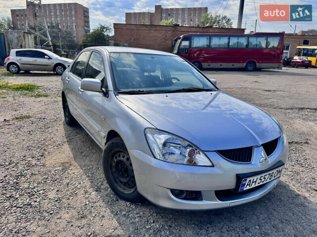 Сірий Міцубісі Lancer, об'ємом двигуна 1.58 л та пробігом 292 тис. км за 5000 $, фото 15 на Automoto.ua