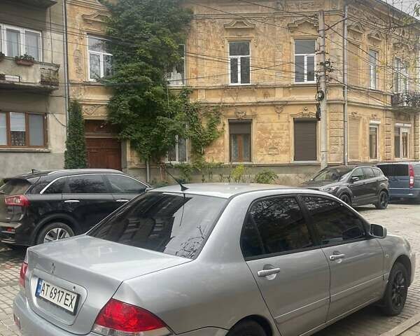 Сірий Міцубісі Lancer, об'ємом двигуна 1.58 л та пробігом 315 тис. км за 2350 $, фото 1 на Automoto.ua