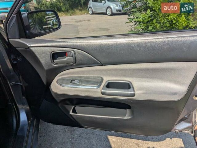 Сірий Міцубісі Lancer, об'ємом двигуна 1.58 л та пробігом 384 тис. км за 2500 $, фото 18 на Automoto.ua
