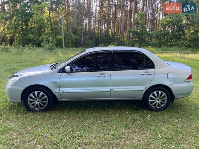 Сірий Міцубісі Lancer, об'ємом двигуна 1.58 л та пробігом 130 тис. км за 4600 $, фото 3 на Automoto.ua