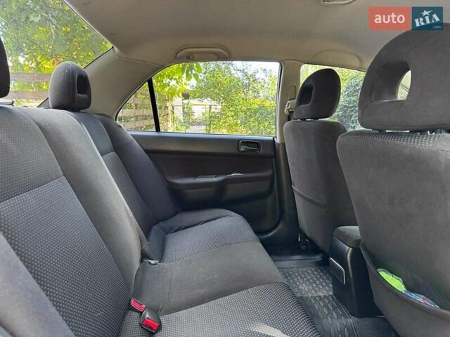 Серый Мицубиси Лансер, объемом двигателя 1.6 л и пробегом 196 тыс. км за 4490 $, фото 23 на Automoto.ua