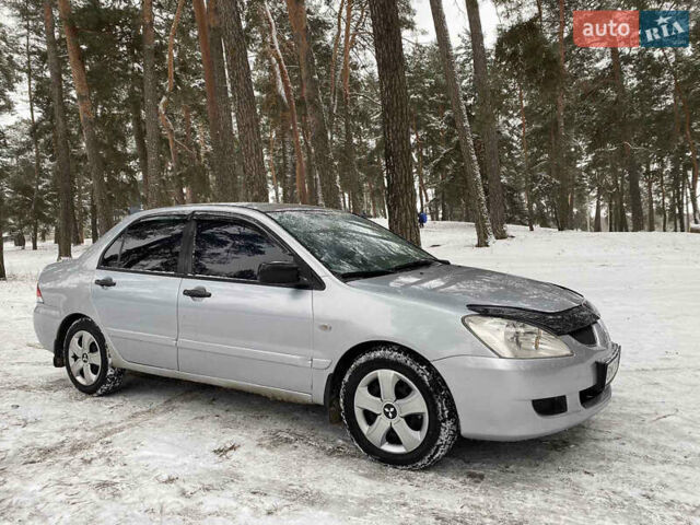 Серый Мицубиси Лансер, объемом двигателя 1.58 л и пробегом 225 тыс. км за 3950 $, фото 5 на Automoto.ua