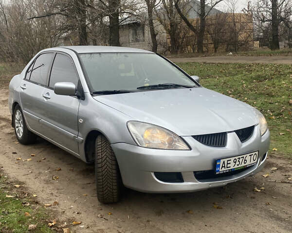Серый Мицубиси Лансер, объемом двигателя 1.58 л и пробегом 210 тыс. км за 3900 $, фото 6 на Automoto.ua