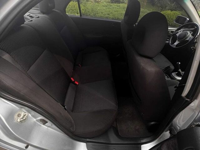 Серый Мицубиси Лансер, объемом двигателя 1.58 л и пробегом 290 тыс. км за 3800 $, фото 7 на Automoto.ua