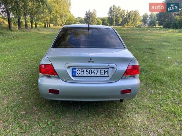 Сірий Міцубісі Lancer, об'ємом двигуна 1.58 л та пробігом 130 тис. км за 4600 $, фото 6 на Automoto.ua