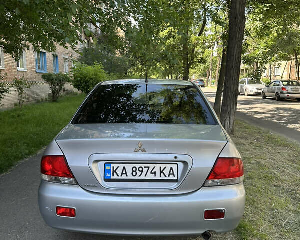 Сірий Міцубісі Lancer, об'ємом двигуна 1.58 л та пробігом 290 тис. км за 3500 $, фото 5 на Automoto.ua