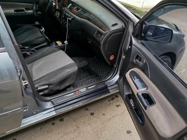 Сірий Міцубісі Lancer, об'ємом двигуна 1.6 л та пробігом 250 тис. км за 5000 $, фото 5 на Automoto.ua