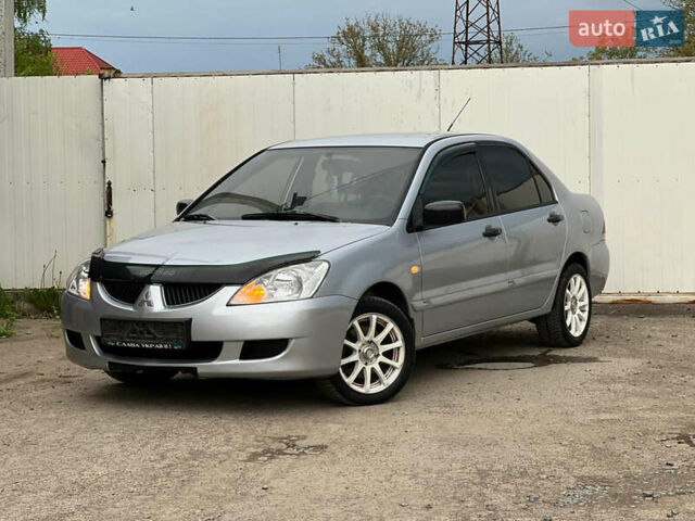 Сірий Міцубісі Lancer, об'ємом двигуна 1.6 л та пробігом 310 тис. км за 3350 $, фото 4 на Automoto.ua