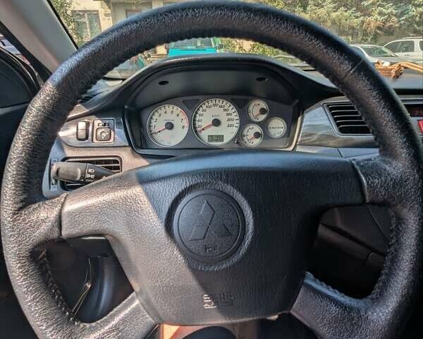 Сірий Міцубісі Lancer, об'ємом двигуна 1.58 л та пробігом 384 тис. км за 2500 $, фото 13 на Automoto.ua