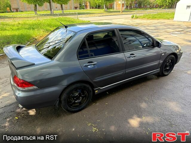 Серый Мицубиси Лансер, объемом двигателя 1.6 л и пробегом 300 тыс. км за 3850 $, фото 4 на Automoto.ua