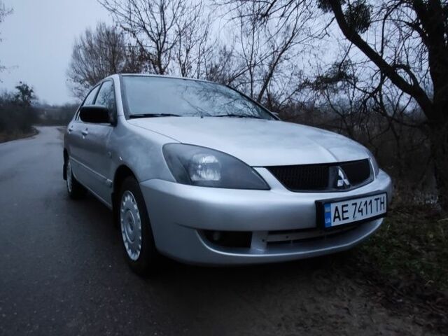 Серый Мицубиси Лансер, объемом двигателя 1.6 л и пробегом 235 тыс. км за 2850 $, фото 18 на Automoto.ua