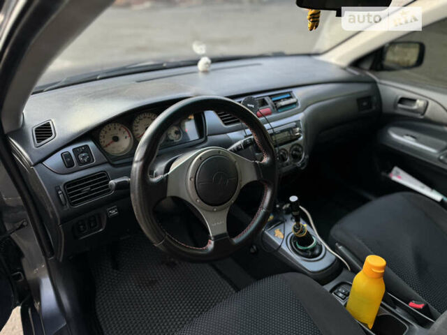 Сірий Міцубісі Lancer, об'ємом двигуна 1.58 л та пробігом 338 тис. км за 4700 $, фото 12 на Automoto.ua