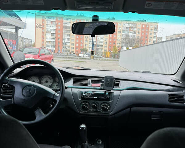 Серый Мицубиси Лансер, объемом двигателя 1.58 л и пробегом 260 тыс. км за 3500 $, фото 14 на Automoto.ua