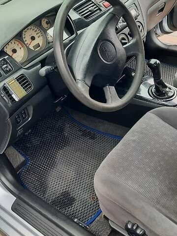 Серый Мицубиси Лансер, объемом двигателя 1.6 л и пробегом 277 тыс. км за 3500 $, фото 1 на Automoto.ua