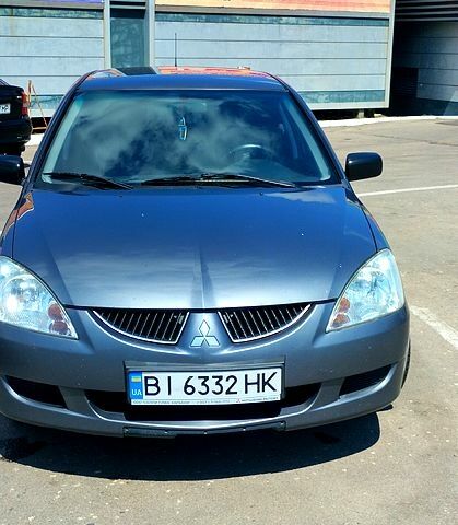 Сірий Міцубісі Lancer, об'ємом двигуна 1.6 л та пробігом 214 тис. км за 3800 $, фото 4 на Automoto.ua