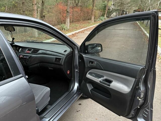 Сірий Міцубісі Lancer, об'ємом двигуна 1.6 л та пробігом 230 тис. км за 2799 $, фото 19 на Automoto.ua
