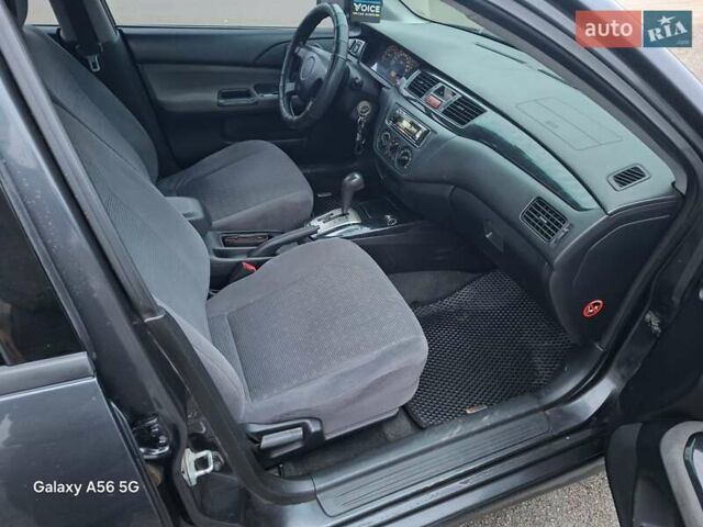 Серый Мицубиси Лансер, объемом двигателя 1.6 л и пробегом 305 тыс. км за 4000 $, фото 6 на Automoto.ua