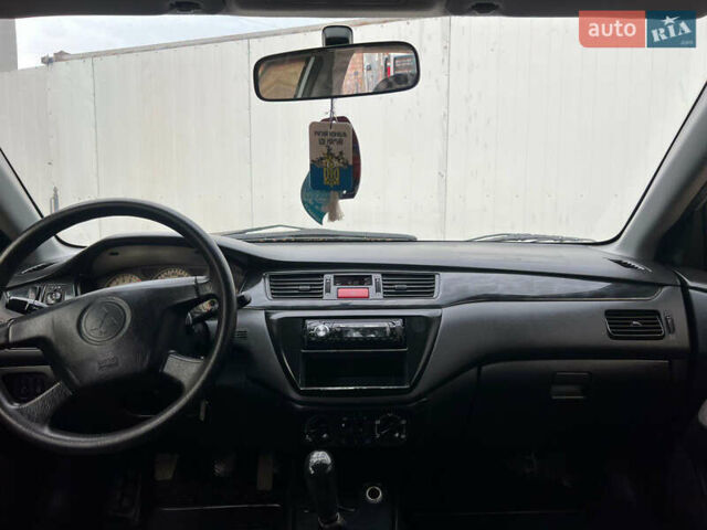 Сірий Міцубісі Lancer, об'ємом двигуна 1.6 л та пробігом 310 тис. км за 3350 $, фото 26 на Automoto.ua