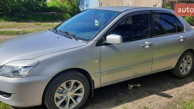 Сірий Міцубісі Lancer, об'ємом двигуна 1.58 л та пробігом 250 тис. км за 5000 $, фото 4 на Automoto.ua