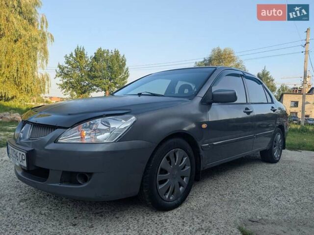 Сірий Міцубісі Lancer, об'ємом двигуна 1.58 л та пробігом 384 тис. км за 2500 $, фото 3 на Automoto.ua