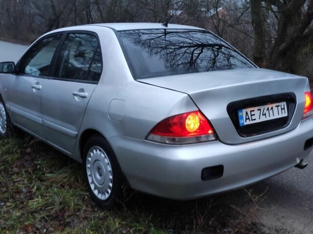 Серый Мицубиси Лансер, объемом двигателя 1.6 л и пробегом 235 тыс. км за 2850 $, фото 4 на Automoto.ua