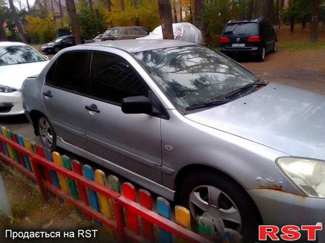 Сірий Міцубісі Lancer, об'ємом двигуна 1.6 л та пробігом 360 тис. км за 1999 $, фото 2 на Automoto.ua